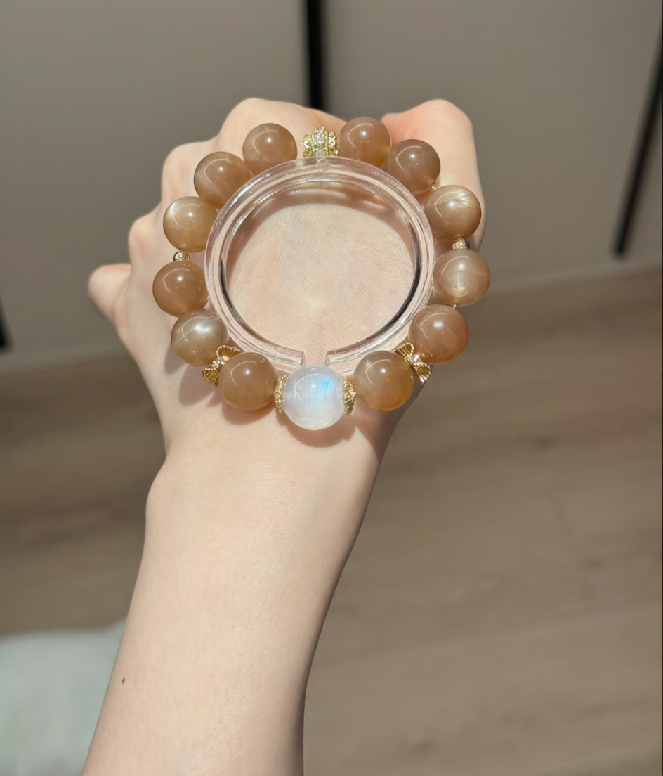 Holding Orange & Blue Moonstone Bracelet, Silver-Gold Accents Amplify Fire-Water Sync Sharpness