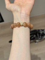 Wearing Orange & Blue Moonstone Bracelet On Wrist, Silver-Gold Accents Frame Gilded Manifestation Aura