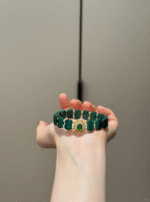 Holding Malachite Bracelet, Earth-Metal Wealth Blast Power