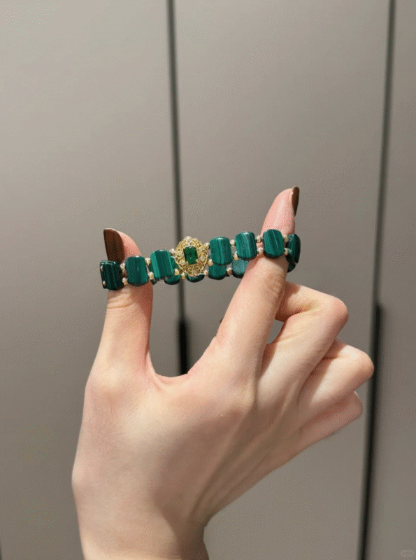 Holding Malachite Bracelet With Silver-Gold Accents, Earth-Metal Energy Weaves Wealth Field