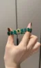 Holding Malachite Bracelet With Silver-Gold Accents, Earth-Metal Energy Weaves Wealth Field