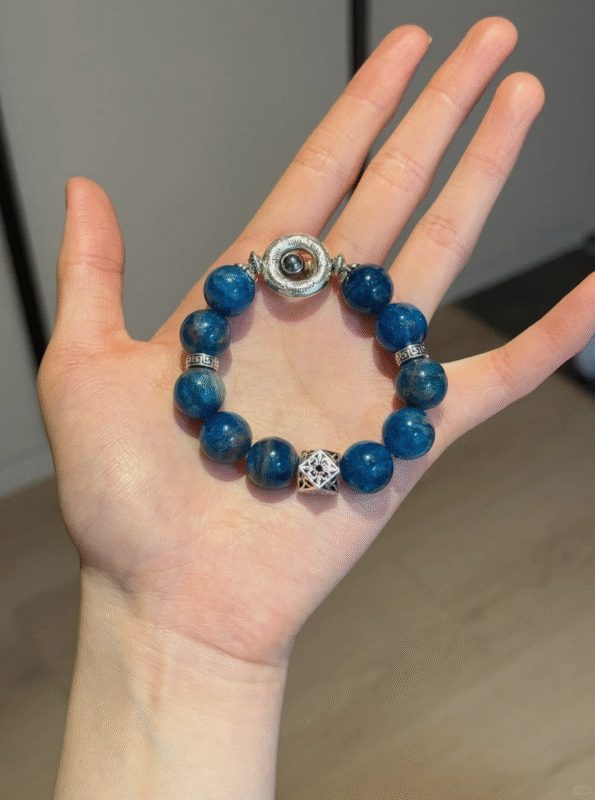 Holding 13.4mm Blue Apatite Bracelet With Silver Accents & Terahertz Bead, Water-Metal-Fire Energies Intertwine