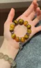 Holding Bracelet With 13mm Golden Tiger’s Eye, 13mm Yellow Tiger’s Eye, 16mm Yellow Tiger’s Eye & Silver Accent, Metal-Fire Energies Intertwine