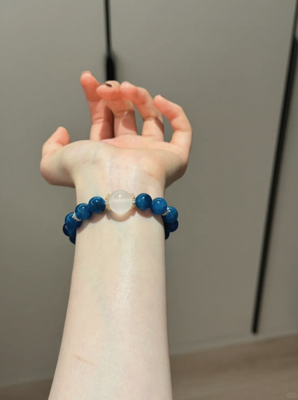 Holding Blue Apatite & Milky Quartz Bracelet, Silver-Gold Amplifies Water-Earth Sync Sharpness