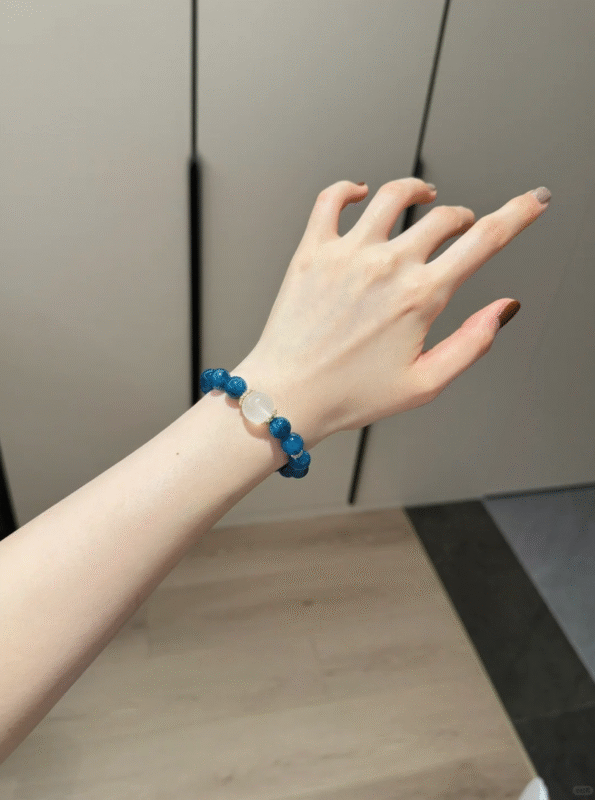 Wearing Blue Apatite & Milky Quartz Bracelet On Wrist, Silver-Gold Frames Healing Aura