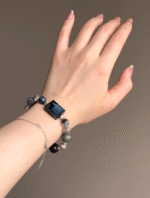 Displaying Pietersite Bracelet Details On Hand, Amulet’s Fire Energy Focus
