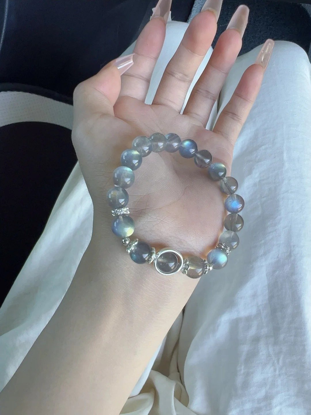 Holding Blue Flash Moonstone Bracelet, Silver Details’ Metal Anchoring
