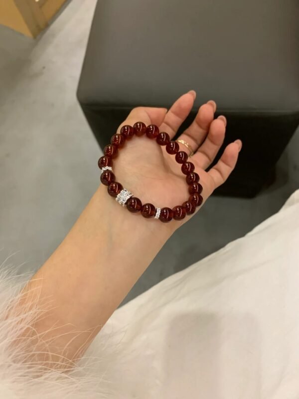 Holding Garnet Bracelet, Fire Energy Focus In Round Beads