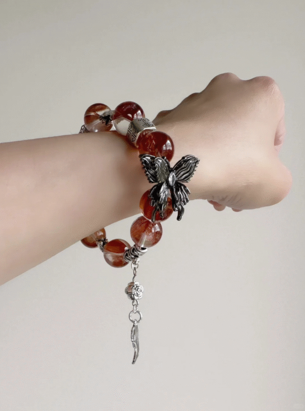 Holding Red Fire Quartz Bracelet, Silver Butterfly’s Metal Protection