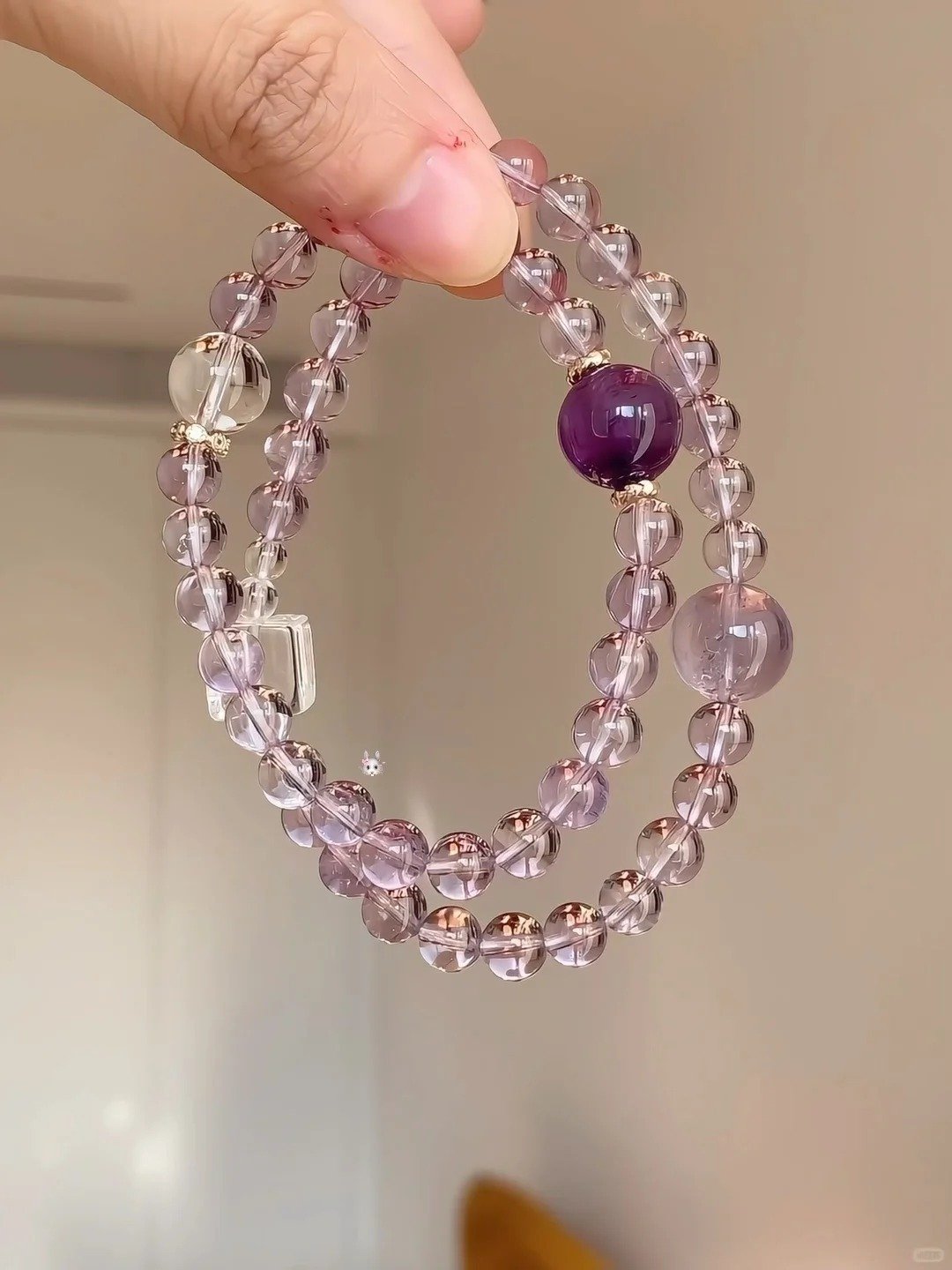 Holding Bolivian Amethyst Double-Wrap Bracelet, Clear Quartz Cube Lights Up Spiritual Field
