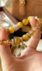 Holding 10mm Gold Tiger Eye & Citrine Bracelet, Metal Anchoring Details Of Silver-Gold Plated