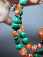 Double-strand bracelet displaying color collision of Red Fire Quartz and Malachite, resonating fire-wood energy