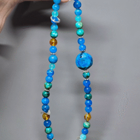 Close-up of Amber and Blue Apatite in sync, metal-element amplifying water-wood energy resonance
