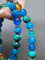 Close-up of the Chrysocolla/Blue Apatite hexagon pendant on a double-strand bracelet with 8mm/9mm Blue Apatite, 8mm Chrysocolla Pine, 8mm Amber, 6mm Amazonite
