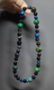 Close-up of Blue Tiger’s Eye and Azurite in sync, silver amplifying wood-water resonance