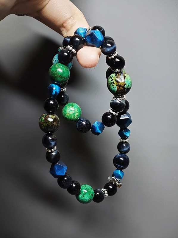 Close-up of 10mm/8mm faceted Blue Tiger’s Eye, wood-element courage explosion points