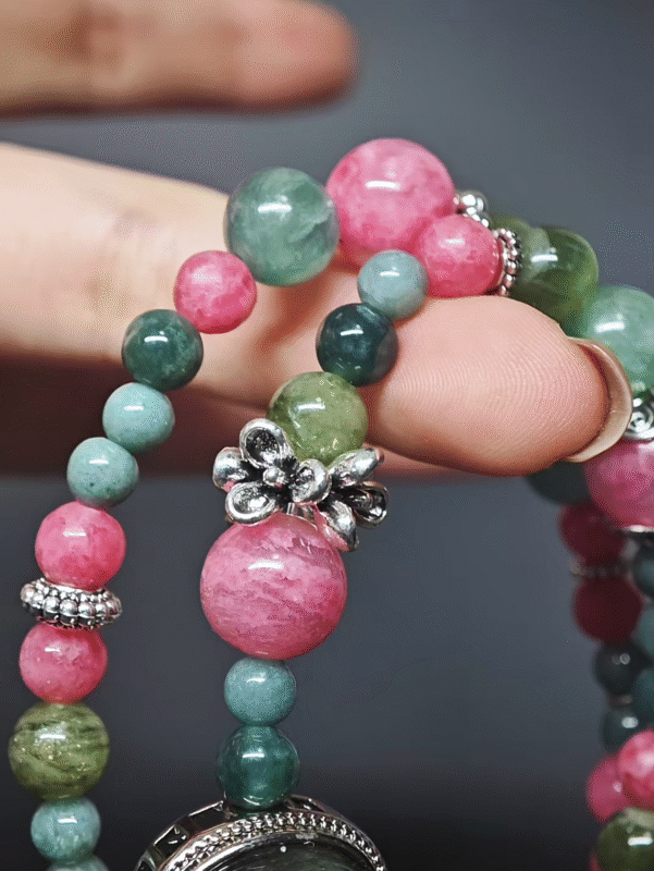 Wearing a double-strand bracelet with a Fuchsite magic box, 6pcs 10mm Rhodonite, 12pcs 8mm Rhodonite, 5pcs 9mm Blue-Green Grandidierite, 6pcs deep 7mm Blue-Green Grandidierite, 14pcs light 7mm Blue-Green Grandidierite, 7pcs 8mm Green Grandidierite, showcasing wood-fire-earth-metal energy fusion