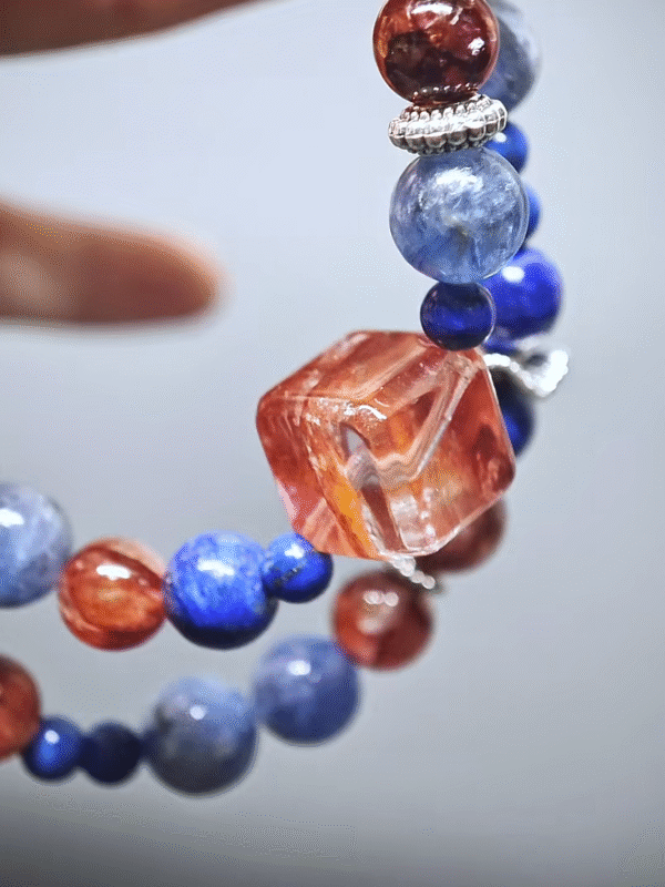Double - strand bracelet displaying color layers of Fire Quartz, Kyanite, and Lapis Lazuli, highlighting fire - water - metal synergy