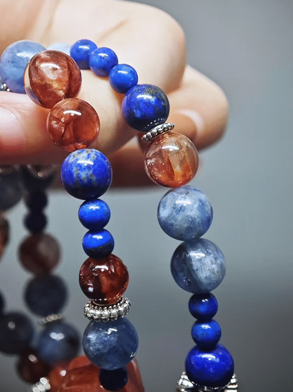 Wearing a double - strand bracelet with a Freeform Fire Quartz Magic Box, a Cushion - cut Fire Quartz, 12pcs 8mm Ox - Blood Fire Quartz beads, 12pcs 8mm Kyanite beads, 8pcs 8mm Lapis Lazuli beads, and 12pcs 5mm Lapis Lazuli beads, showcasing fire - water - metal energy collision