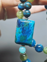 Close-up of the Chrysocolla square pendant, core wood-element breakthrough hub