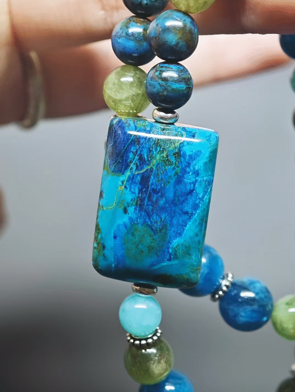 Close-up of the Chrysocolla square pendant, core wood-element breakthrough hub