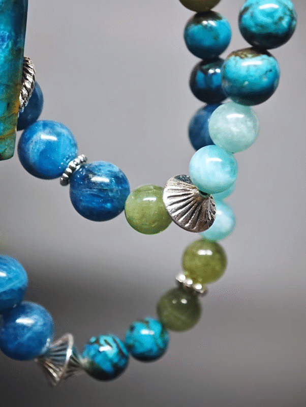 Double-strand bracelet displaying color layers of Chrysocolla, Green Grandidierite, Amazonite, Blue Apatite, highlighting wood-earth-water synergy