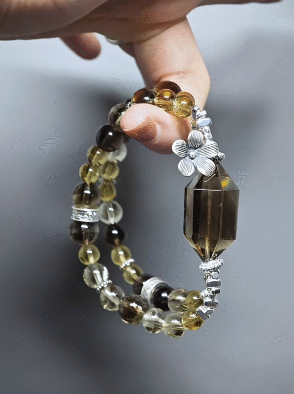 Dynamic display of the bracelet, resonating Smoky Quartz stability and Tea-Yellow Citrine vitality
