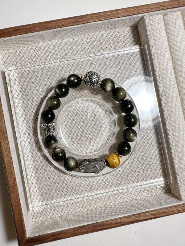 Bracelet in display box, details of Gold Obsidian’s golden sheen and silver Pixiu, synergy of water-metal energy
