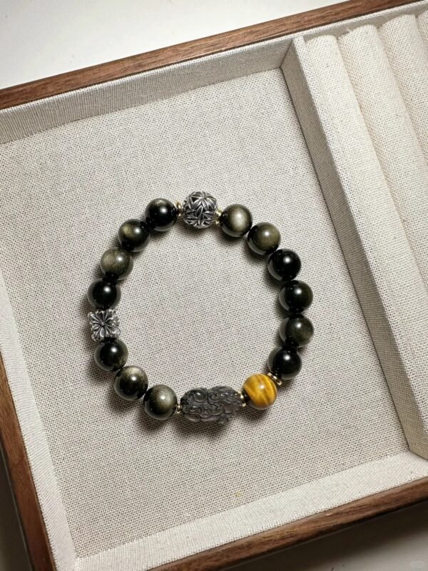 Bracelet with 10mm Yellow Tiger Eye, 13pcs 10mm Gold Obsidian, and silver Pixiu, showcasing earth-water-metal energy fusion