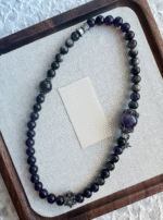 Details of the Amethyst and Silver Obsidian Capricorn bracelet, interpreting water-metal energy synergy for zodiac protection