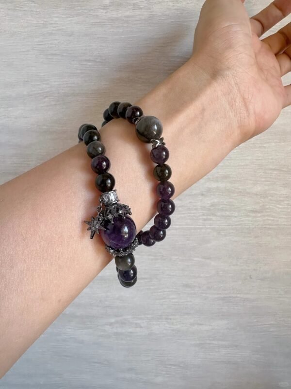 Wearing a Capricorn guardian bracelet with Amethyst and Silver Obsidian, showing water-metal energy fusion