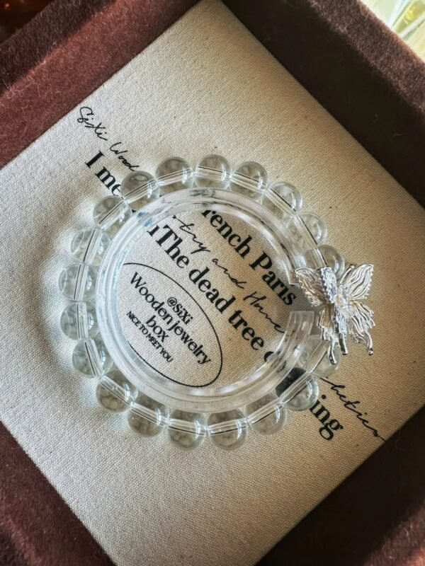 Bracelet with 8mm Clear Quartz beads and silver butterfly pendant, showcasing pure resonance of metal-element energy