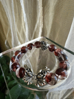 Blood Red Fire Quartz bracelet in scene, fire-metal story of Beauty & Beast