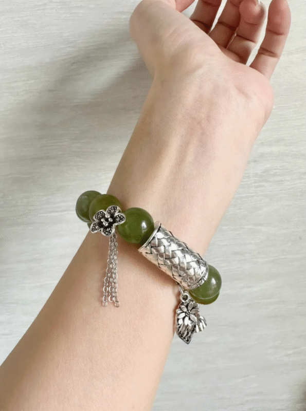 Wearing 14mm Xiu Jade bracelet with silver accents, showcasing wood-element vitality