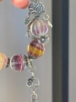 Close-up of Rainbow Fluorite bracelet, colorful beads’ energy secrets