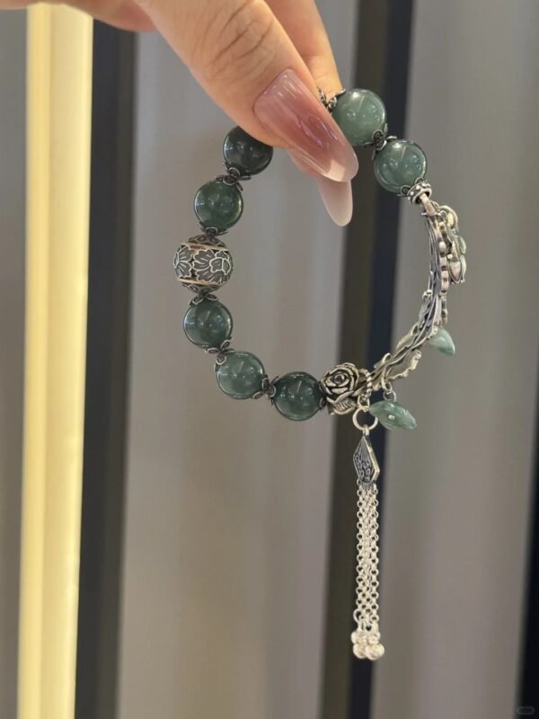 Side view of jadeite bracelet, silver and beads balancing earth-metal beauty