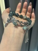 Multi-bead arrangement of jadeite bracelet, silver details highlighting earth-metal energy field