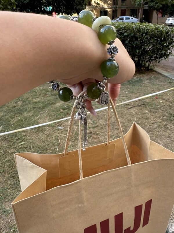 Green Grape Xiu Jade bracelet with shopping bag, wood-metal energy manifesting in life