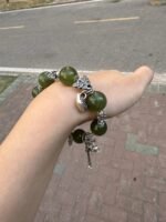 Detail of Green Grape Xiu Jade bracelet, wood-metal synergy between jade ring and silver