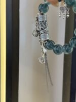 Palm view of Blue Fluorite bracelet, intimate water-metal energy resonance