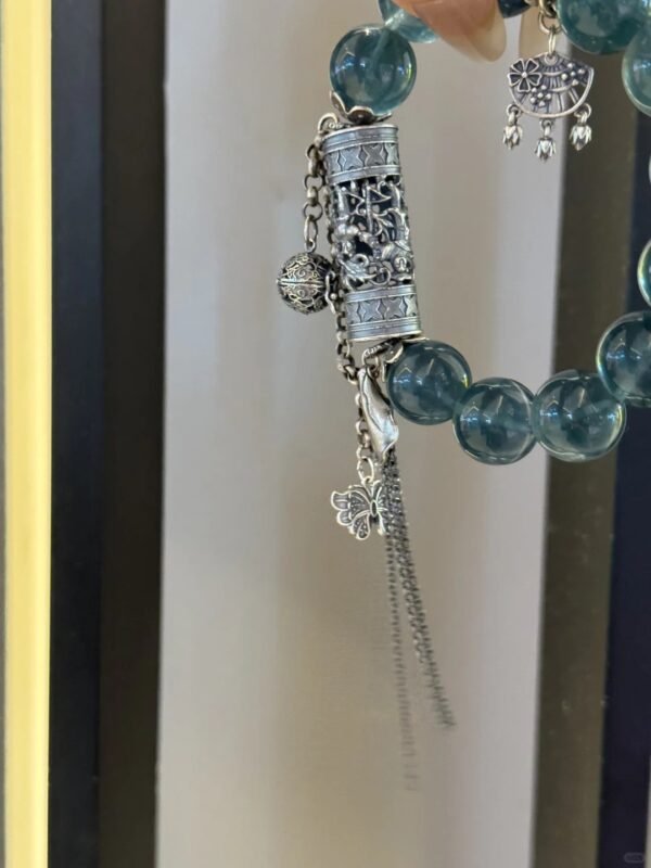 Palm view of Blue Fluorite bracelet, intimate water-metal energy resonance