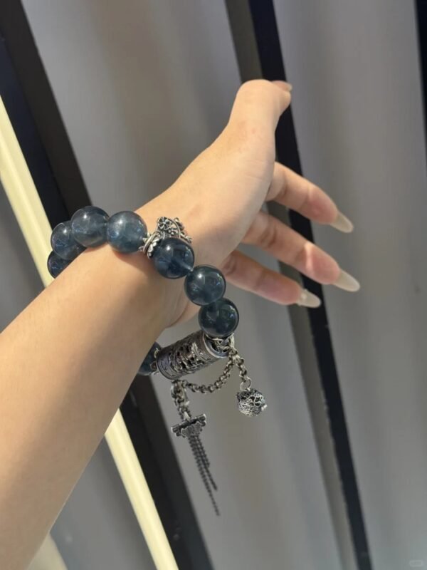 Detail of Blue Fluorite bracelet, silver fan totem and beads, water-metal synergy