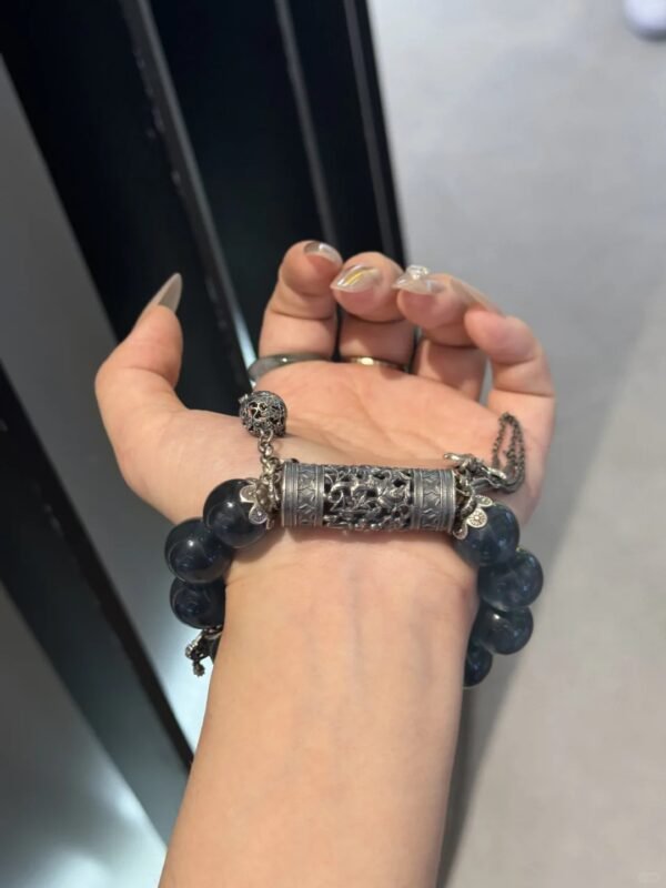 Close-up of Blue Fluorite bracelet with silver hollow tube and tassels, water-metal energy blooming