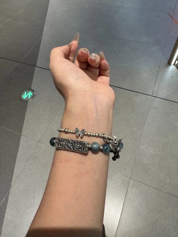 Wearing Blue-Green Quartz bracelet, silver accents showcasing water-metal energy bloom