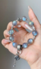Detail of Gray Moonstone bracelet, silver accents & beads’ water-metal synergy