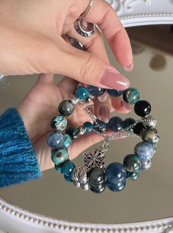 Multi-gem bracelet worn, daily blue-metal energy nourishment