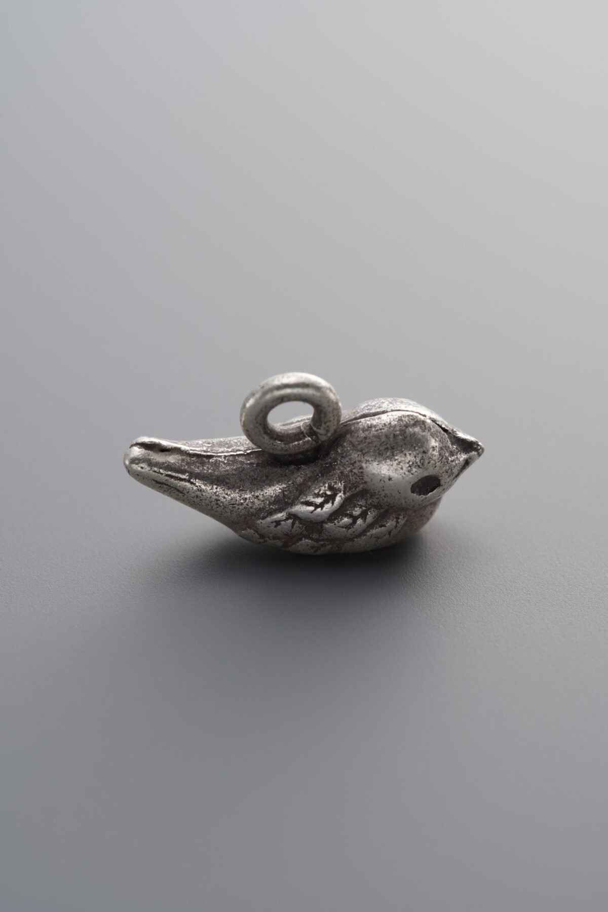 925 Sterling Silver-Antiqued-Petite Bird Pendant-15mm - Image 1