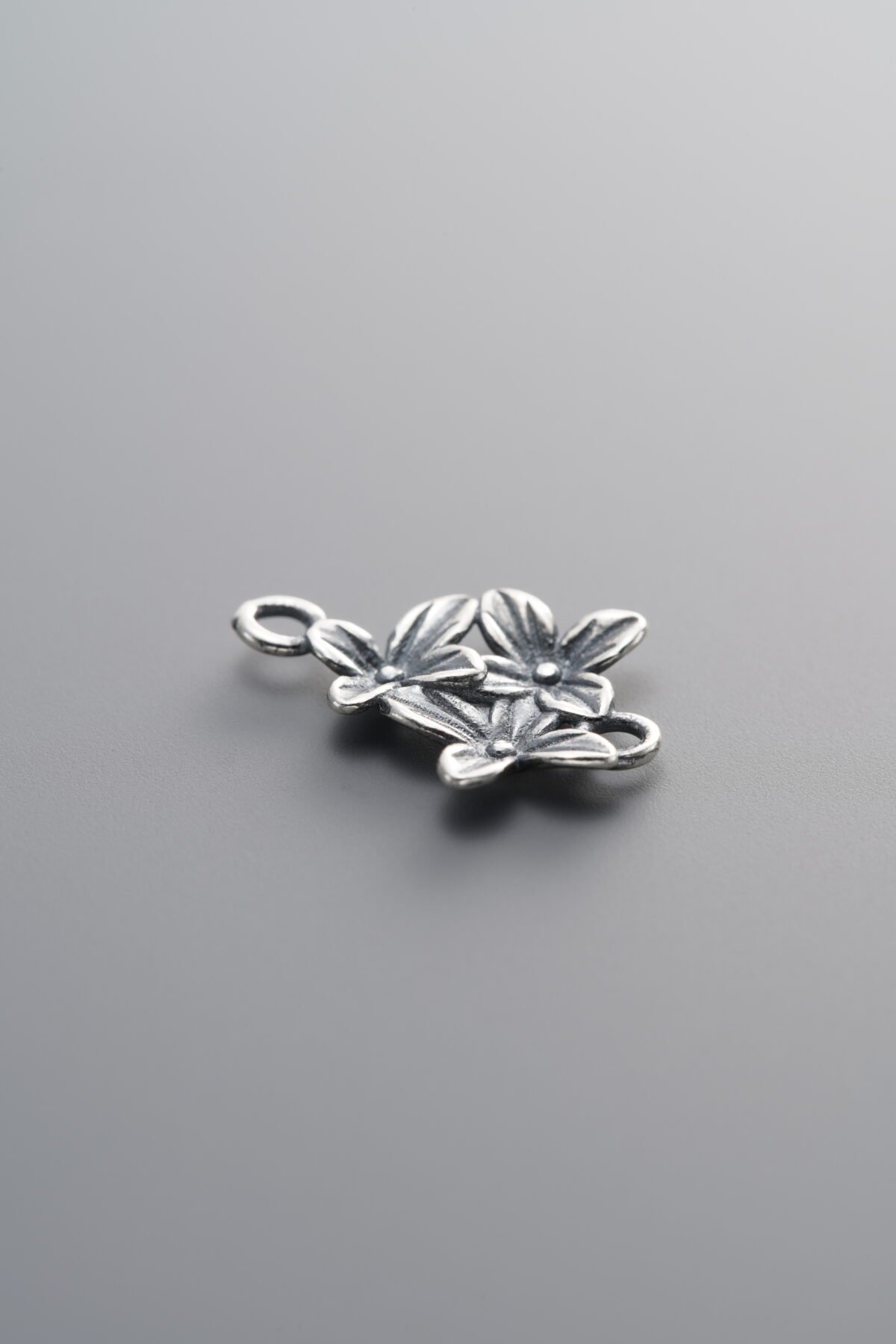 925 Sterling Silver-Antiqued-Three-Flower Double-Eye Connector-15mm - Image 1