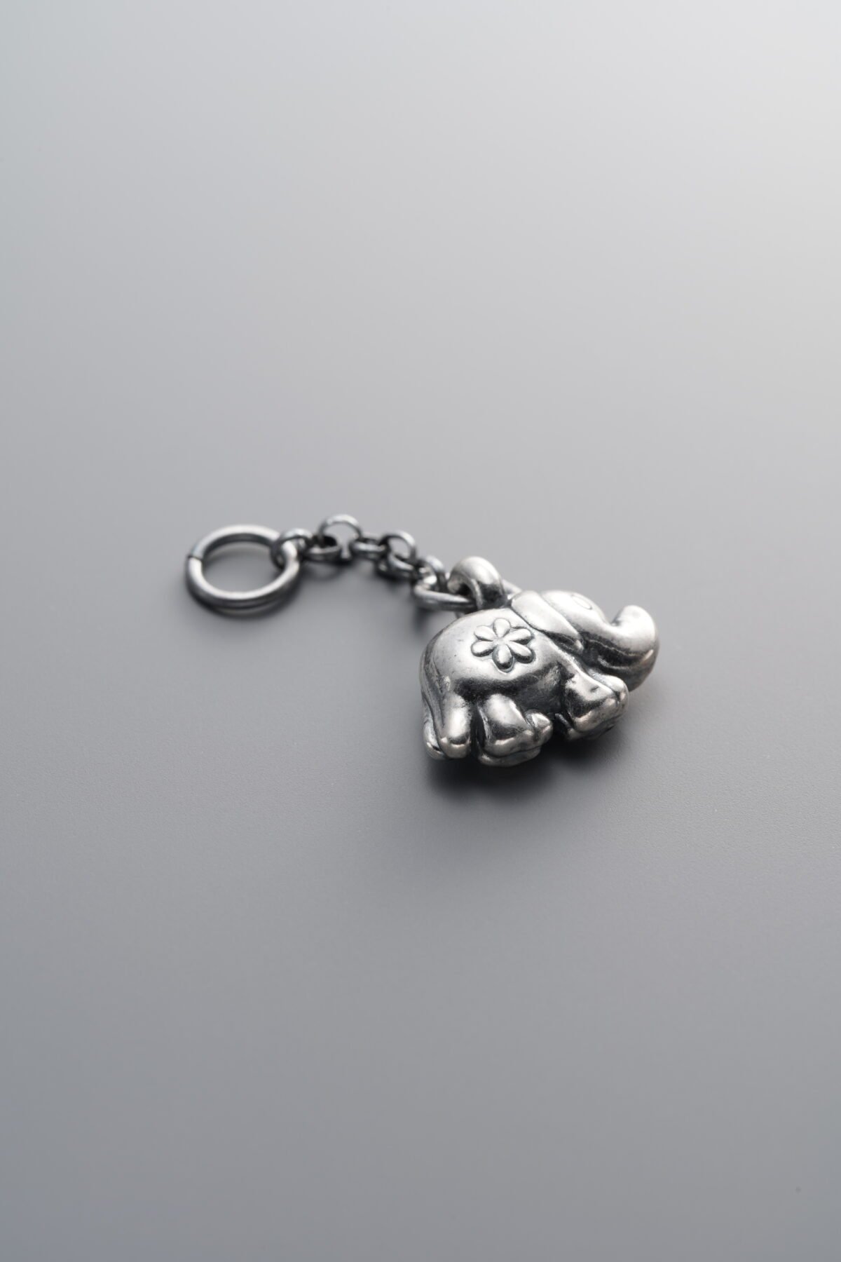999 Fine Silver-Antiqued-Dimensional Elephant Tassel Pendant-30mm - Image 1