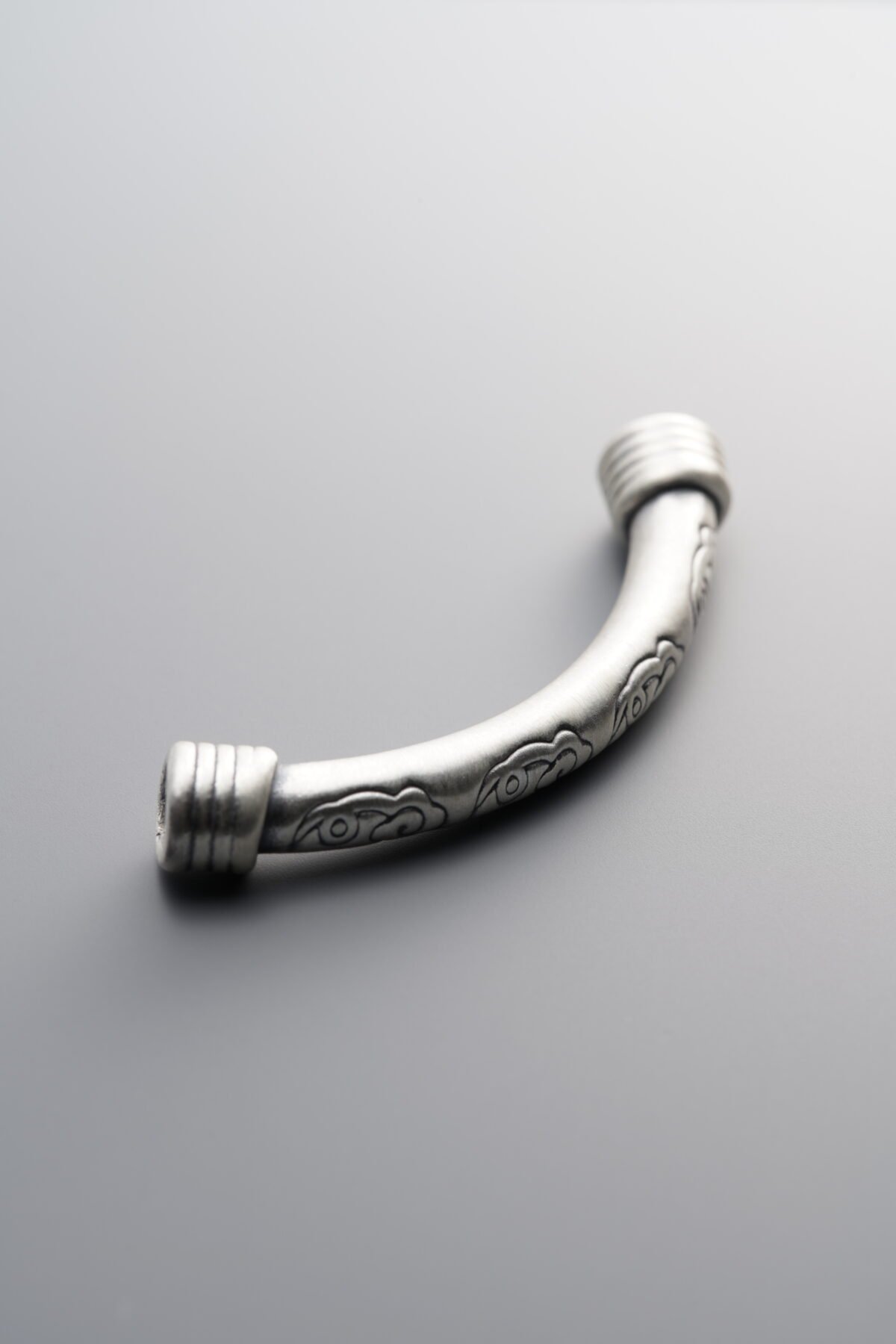 999 Fine Silver-Antiqued-Cloud Pattern Curved Tube Bead-43mm - Image 1